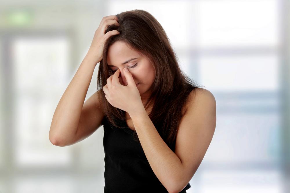 woman having a migraine headache